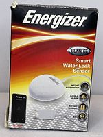 Box front showing Energizer Smart Water Leak Sensor model with features such as instant notification, audible alarm, battery powered, and WiFi connection.