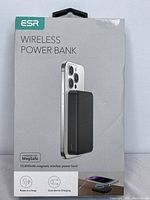 Front of retail box showing ESR branding, product name, image of power bank magnetically attached to an iPhone, and key features.