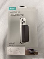 Front of ESR wireless power bank box showing product image attached to iPhone, branding, and key features