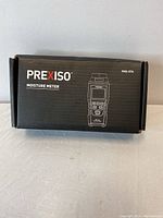 Closed box for Prexiso PMX-57A Moisture Meter showing model and branding.