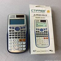 Photo of the CTIFREE FX-991ES PLUS scientific calculator alongside its original packaging box, showing the device front screen and keypad