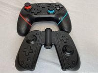 Two Nintendo Switch controllers placed side by side showing front buttons and grips.