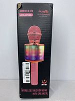 Front view of the boxed wireless microphone showing the product image of a pink handheld microphone with integrated LED lighted speaker labeled WS-858L.