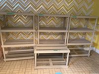 Three stacked plastic shelving units arranged against a wall showing overall size and number of shelves.