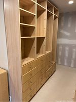 Front view of assembled closet storage showing shelving modules and drawers