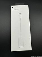 Front view of the Apple USB-C to USB Adapter sealed in original white box packaging.