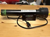 Side view of the Uvonair 3000 ozone generator showing the attached control box and power cord.