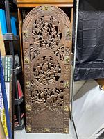 Full front view of carved hardwood door panel