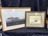 Two framed Andrew Wyeth artworks side by side on a black background