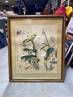 Full view of the framed Asian art piece depicting lotus flowers, fish, and birds.