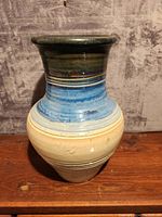 Front view of large pottery vase showing full height and colors.