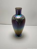 Front view of the iridescent art glass vase showing color and pattern