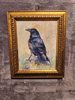 Front view of the oil painting depicting a raven on a branch in an ornate gold frame.