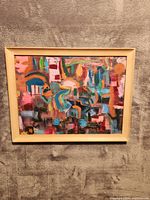 Front view of framed abstract painting displaying colorful brushwork and composition