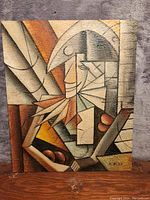 Front view of the abstract oil painting showing geometric shapes and earthy tones.