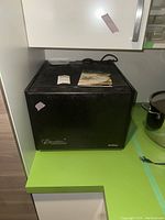 Front view of closed dehydrator showing Excalibur logo