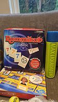 Photo of Rummikub Classic game box and dice set Max Liquidator.