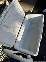 Large white Coleman cooler with lid open showing interior and no cracks.
