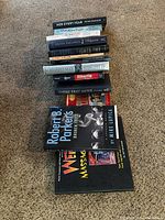 Top view of book stack showing multiple titles and variety of book types