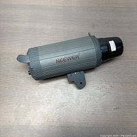 Side view of the Neewer LED video light unit showing brand and gray housing with mounting bracket.