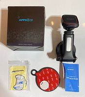 Ads2Car Dashboard Car Mount with box, suction cup base, and accessories including adhesive pads and user manual.