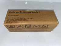 Cardboard box packaging for a body heating pad with printed product details including temperature settings and care instructions.