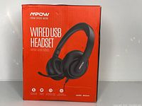 Front view of new MPOW Wired USB Headset box showing the headset illustration and branding.