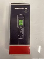 Box front showing multifunction water tester with LCD screen illustration.