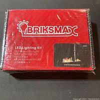 Front of red box packaging showing BRIKSMAX logo and LED Lighting Kit text.