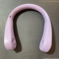 Front view of lavender wireless hanging neck fan showing fan vents and USB charging port.