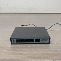 Front view of the Sodola Ethernet switch showing five 2.5G Ethernet ports, model and brand labeling, and power LED indicator light.