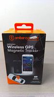 Front of retail box showing Amber Connect branding, product name, and image of GPS tracker with mobile phone app screen.