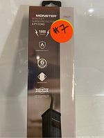 Box of the Monster surge protector showing product features such as 1800 joules, 6 foot cord, fireproof MOV, braided cord, and equipment protection policy.