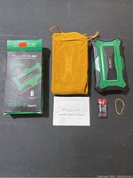 Photo of the Fuzion FU-200 professional digital scale box, soft pouch, warranty card, batteries and rubber band