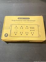 Box front featuring the TROND Prime IV surge protector with USB charger, showing 7 outlets and 3 USB ports.