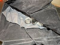 Close-up of the dark-colored, plush SUV air mattress showing the built-in inflation valves.