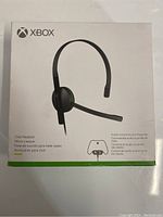 Front view of the Xbox Chat Headset box showing the headset image, brand, and listing information.