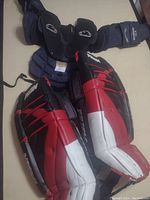 36-inch Prism Kon-Tiki goalie pads and Casco TCU II chest protector laid out together