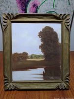 Front view of framed pastel landscape painting