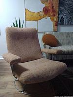 Front view of the swivel lounge chair in room setting