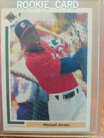 Front image of the 1991 Upper Deck SP Michael Jordan baseball rookie card showing him batting in a red White Sox uniform with a bat.