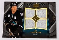 Hockey card featuring Joe Thornton in a San Jose Sharks jersey with four swatches of white game-worn jersey fabric and gold trim. Numbered 09/99 on the front.