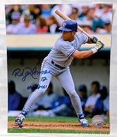 Full 8x10 photo of Roberto Alomar in batting stance with autograph visible