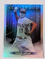 Front view of Shohei Ohtani Stars of MLB holo foil baseball card in Angels uniform with pitching pose.