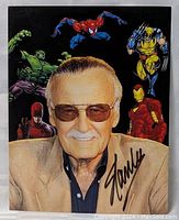 Full view of the 8x10 autographed photo showing Stan Lee with Marvel superheroes including Spider-Man, Wolverine, Iron Man, Hulk, Daredevil and the signature on the front.