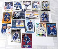 Toronto Maple Leafs hockey card lot of 16 star players laid out on a white surface displaying different players and card designs