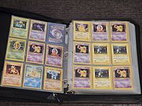 First set of pages showing 18 assorted Pokémon cards including Psyduck, Golduck, and Cubone.