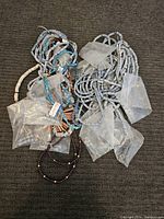 Full view of multiple Southwestern necklaces showing beads and stone pendants