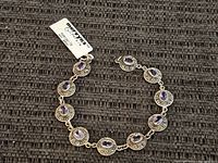 Full view of sterling silver amethyst bracelet showing tag and overall design
