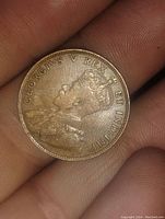 Obverse side showing portrait of King George V and inscription.